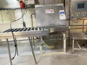 Photo showing white dust on the floor around equipment 